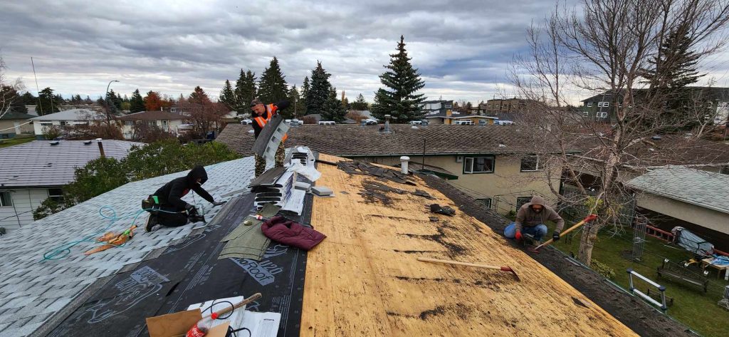 Asphalt shingle installation in progress on a residential property
