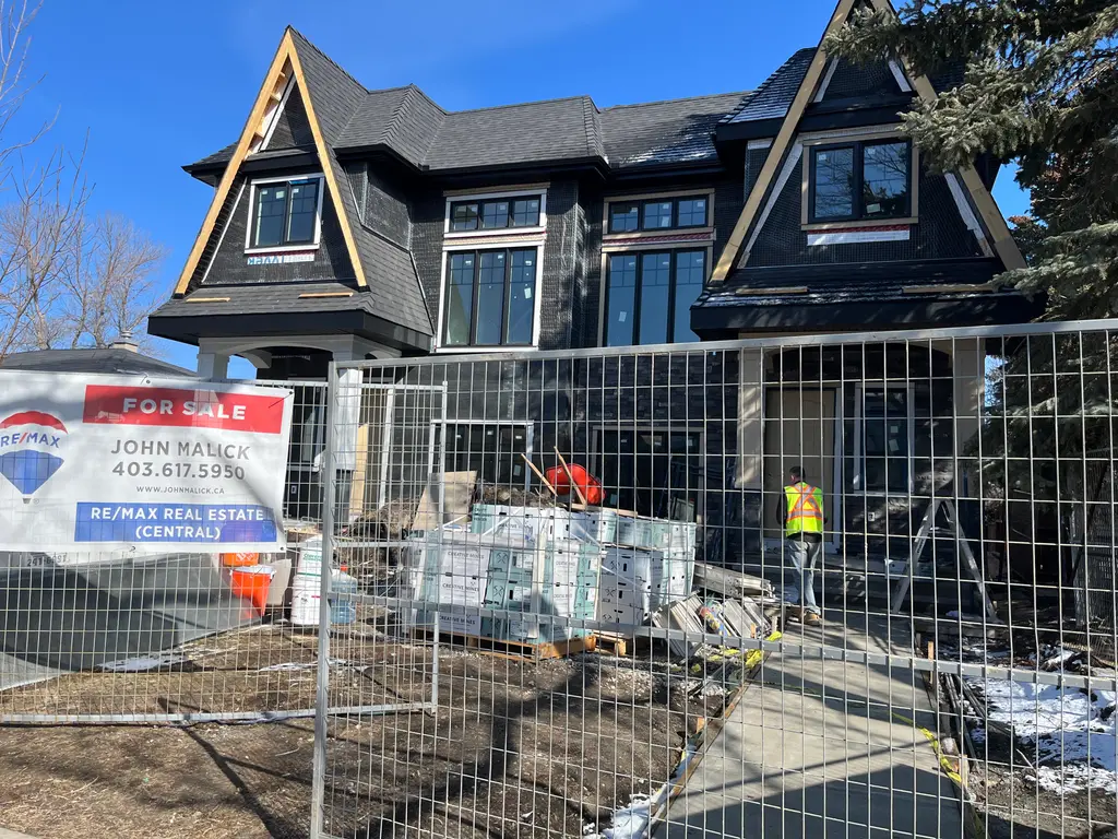 Completed asphalt shingle roof replacement on a Calgary home